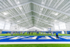 The UB Football team practices in the new Murchie Family Fieldhouse on the North Capus of University at Buffalo in April 2019. Photographer: Paul Hokanson