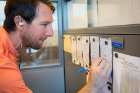 Cory Nealon keeps a tally in his office of the number of times he rides his bike to work. 