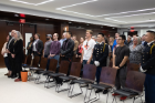 The audience recites the Pledge of Allegiance before the 2023 ceremony. 