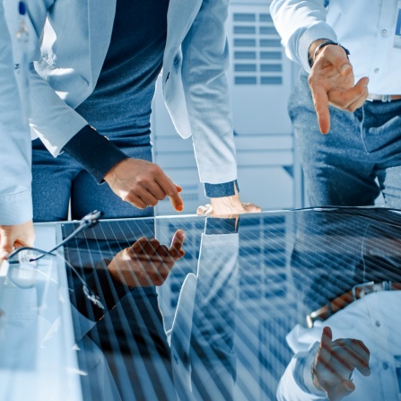Royalty-free stock photo ID: 1501235690 Team Meeting of Renewable Energy Engineers Working on an Innovative More Efficient Solar Panel Battery Concept. Group of Specialists Gathered Around Table, Solving Problems. Bright Research Facility. 
