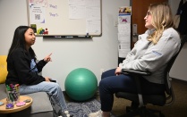 A student is sitting in a Wellness Coaching session with coach, Kayla Hill. 